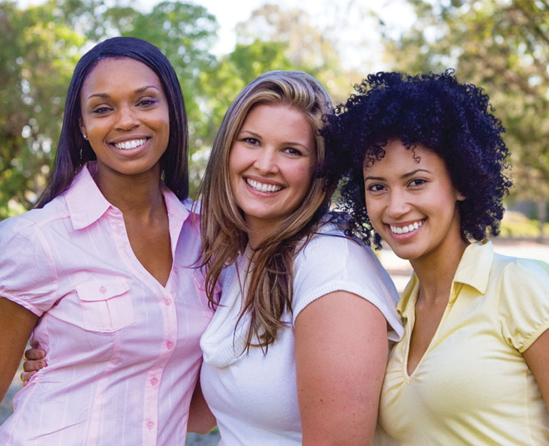 three smiling ladies